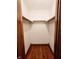 Interior of a walk-in closet with hanging storage space and hardwood floors at 4109 E Epler Ave, Indianapolis, IN 46237