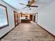 Open-concept living room and kitchen area with hardwood floors and a ceiling fan at 4109 E Epler Ave, Indianapolis, IN 46237