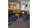 Cozy living room features a plush gray sectional, carpeted floors, and an open view to the kitchen at 4125 Dequincy St, Indianapolis, IN 46226