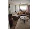 Inviting living room featuring a brown sectional sofa, soft rug, and decorative accents at 4125 Dequincy St, Indianapolis, IN 46226