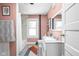 Charming bathroom with colorful patterned flooring, modern sink, and bathtub with shower at 4429 Crittenden Ave, Indianapolis, IN 46205