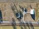 Aerial view highlighting blue house, property layout and fields on a sunny day at 4844 N 700 W, McCordsville, IN 46055