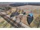 Aerial view highlighting the farmhouse, barn, and surrounding landscape, conveying the property's spaciousness at 4844 N 700 W, McCordsville, IN 46055