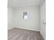 Neutrally painted bedroom featuring soft gray carpet, a window and a closet at 4844 N 700 W, McCordsville, IN 46055