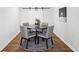 Stylish dining room with round table, four chairs, hardwood floors and modern decor at 4844 N 700 W, McCordsville, IN 46055