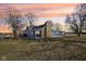 Beautifully renovated home featuring a stone chimney and sprawling front yard, ideal for outdoor activities at 4844 N 700 W, McCordsville, IN 46055