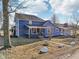 Two-story blue home featuring an sunroom and charming architectural details at 4844 N 700 W, McCordsville, IN 46055
