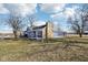 Charming blue home with a stone chimney and a covered porch, surrounded by a grassy yard at 4844 N 700 W, McCordsville, IN 46055