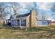 Charming blue home with a stone chimney and a covered porch, surrounded by a grassy yard at 4844 N 700 W, McCordsville, IN 46055