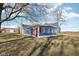 Blue home addition features bright, natural light and a vibrant red door at 4844 N 700 W, McCordsville, IN 46055