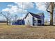Two-story blue home featuring an sunroom and charming architectural details at 4844 N 700 W, McCordsville, IN 46055