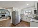 Updated kitchen boasts white cabinets and stainless steel appliances at 4844 N 700 W, McCordsville, IN 46055