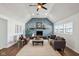 Vaulted ceiling living room featuring stone fireplace and three windows providing natural light at 4844 N 700 W, McCordsville, IN 46055