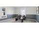 Comfortable living room with neutral carpet, stylish wainscoting, and ample light, creating an inviting atmosphere at 4844 N 700 W, McCordsville, IN 46055
