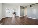 Spacious living room featuring a grey paneled wall and new flooring at 4844 N 700 W, McCordsville, IN 46055