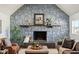 Living room with a stone fireplace, vaulted ceiling, and hardwood floors at 4844 N 700 W, McCordsville, IN 46055