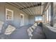 Bright sunroom features neutral paint scheme, exposed rafter ceiling, and multiple windows at 4844 N 700 W, McCordsville, IN 46055
