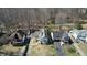 An aerial view of a lovely home with beautiful landscaping and a pond surrounded by mature trees at 5014 Melbourne Rd, Indianapolis, IN 46228