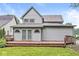 Exterior view of home with large wooden deck and private backyard at 5014 Melbourne Rd, Indianapolis, IN 46228