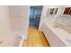 Bright bathroom with dual vanity, and bathtub with showerhead at 5014 Melbourne Rd, Indianapolis, IN 46228