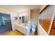 Bathroom features a dual vanity, with decorative walls, and a large mirror at 5014 Melbourne Rd, Indianapolis, IN 46228