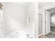 Cozy bathroom featuring a soaking tub and a separate shower at 5014 Melbourne Rd, Indianapolis, IN 46228
