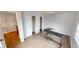 This bedroom has wood laminate flooring, a ceiling fan, neutral paint and two closets at 5014 Melbourne Rd, Indianapolis, IN 46228