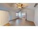 Inviting bedroom with neutral walls, ceiling fan, and wood-look floors at 5014 Melbourne Rd, Indianapolis, IN 46228