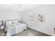 Cozy bedroom with hardwood floors, comfortable bed, and plenty of natural light at 5014 Melbourne Rd, Indianapolis, IN 46228