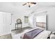 This bedroom features vaulted ceilings, gray wood flooring, and neutral paint at 5014 Melbourne Rd, Indianapolis, IN 46228