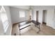 Bedroom with ceiling fan, hardwood floors, and an open doorway to a walk-in closet at 5014 Melbourne Rd, Indianapolis, IN 46228