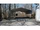 A metal carport sits behind the home and provides covered parking at 5014 Melbourne Rd, Indianapolis, IN 46228