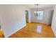 Traditional dining room featuring hardwood floors and a stylish chandelier fixture at 5014 Melbourne Rd, Indianapolis, IN 46228
