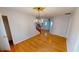Charming dining room featuring hardwood floors and a star-shaped chandelier at 5014 Melbourne Rd, Indianapolis, IN 46228