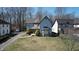 Charming two-story home with stone accents, bay window, and beautifully landscaped front yard at 5014 Melbourne Rd, Indianapolis, IN 46228
