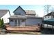 The backyard features a large wood deck, a metal carport, and gray siding at 5014 Melbourne Rd, Indianapolis, IN 46228