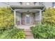 Charming front porch with stone accents, mature landscaping, and a welcoming entrance at 5014 Melbourne Rd, Indianapolis, IN 46228