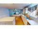 Well-lit kitchen with ample counter space, modern appliances, and open layout to a living area at 5014 Melbourne Rd, Indianapolis, IN 46228