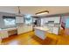 Spacious kitchen featuring white cabinets, stainless steel appliances, and a functional island at 5014 Melbourne Rd, Indianapolis, IN 46228