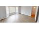 Bright living room with laminated wood flooring, a bay window and natural light at 5014 Melbourne Rd, Indianapolis, IN 46228