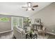Living room featuring vaulted ceilings, ceiling fan, and views to outside at 5014 Melbourne Rd, Indianapolis, IN 46228