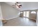 Bright living room with vaulted ceilings, a ceiling fan, and French doors to the outdoor at 5014 Melbourne Rd, Indianapolis, IN 46228