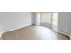 Bright living room with laminated wood flooring and a bay window at 5014 Melbourne Rd, Indianapolis, IN 46228