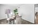 Bright home office with desk, chairs, art and hardwood floors provides a comfortable workspace at 5014 Melbourne Rd, Indianapolis, IN 46228