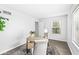 Well-lit home office with a large window, desk and modern decor, perfect for productivity at 5014 Melbourne Rd, Indianapolis, IN 46228
