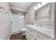 Bright bathroom featuring a glass-enclosed shower, modern vanity, and stylish finishes at 505 W Hunters Dr # D, Carmel, IN 46032