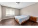 Bedroom features hardwood floors, a large window, and a wooden bed frame at 505 W Hunters Dr # D, Carmel, IN 46032