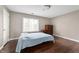 Bedroom with wood floors, neutral walls, and natural light from the window at 505 W Hunters Dr # D, Carmel, IN 46032