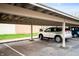 Covered parking with assigned spots in a well-maintained carport area at 505 W Hunters Dr # D, Carmel, IN 46032