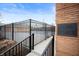 View of the community clubhouse featuring a nearby pool behind a fence at 505 W Hunters Dr # D, Carmel, IN 46032